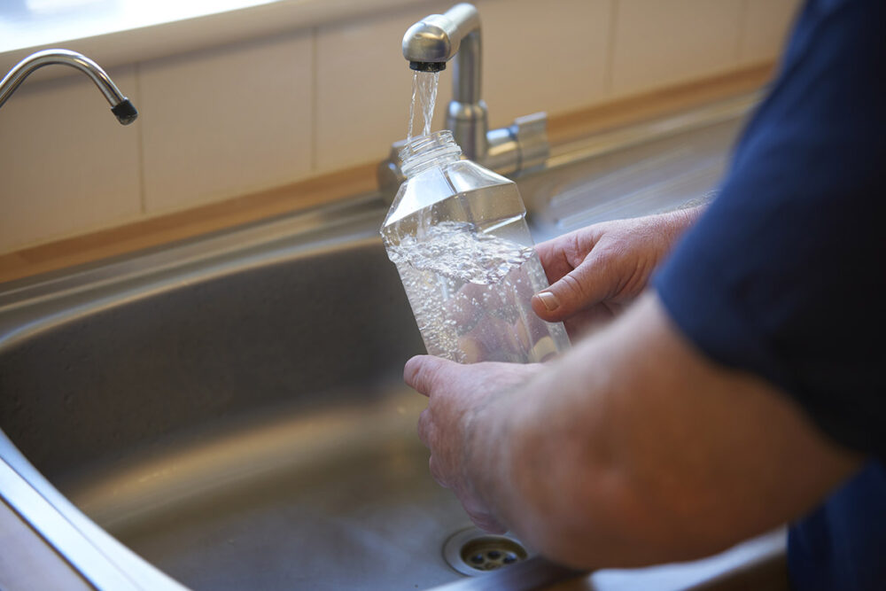 Filling a bottle with filtered tap water